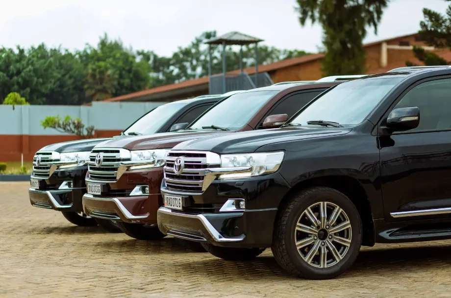 A row of new Toyota Land Cruisers, representing a range of vehicles that could potentially be affected by manufacturing defects under Lemon Law.