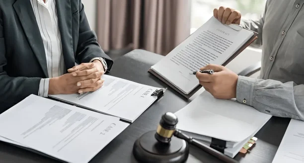 Attorney reviewing legal contract for defective car case