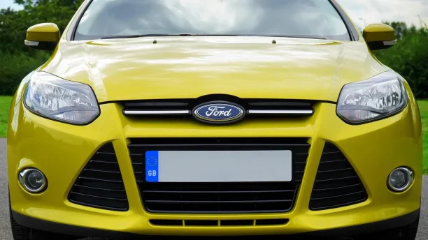 Front view of a yellow Ford vehicle highlighting potential lemon law concerns
