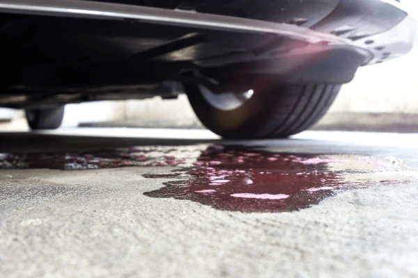 Transmission fluid leaking under a vehicle showing one of the most reported 2020 Chevy Colorado problems by owners