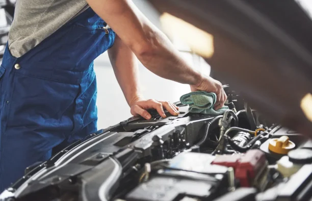 Technician checking engine components for recurring mechanical problems