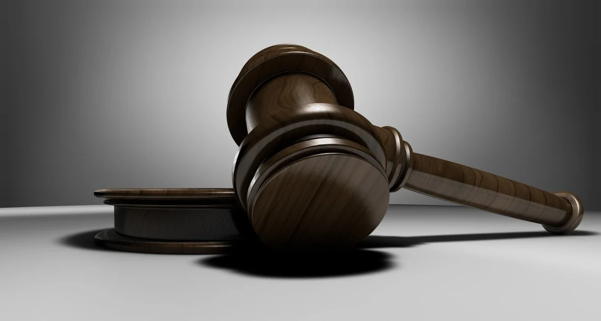 A wooden judge's gavel symbolizing a successful legal settlement or court ruling for a defective 2021 Jeep Compass Trailhawk under lemon law.