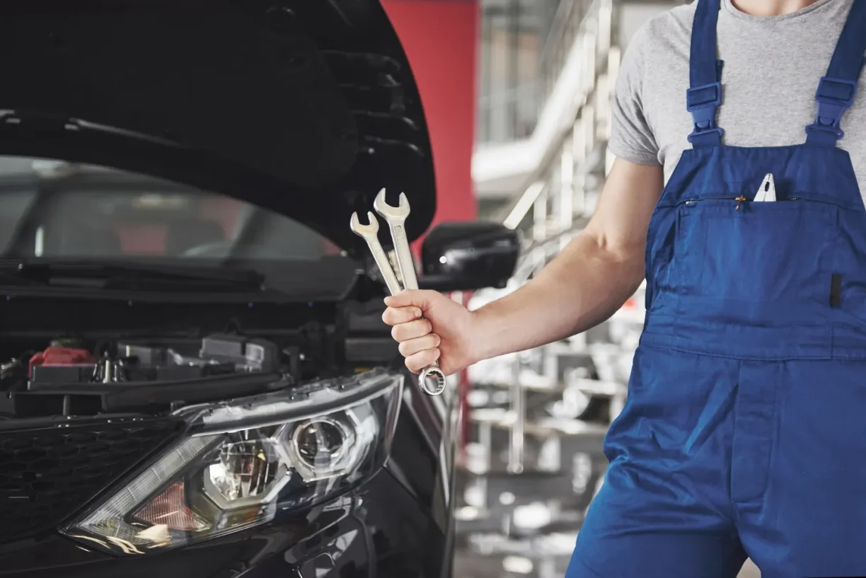 Mechanic inspecting 2021 GMC Canyon AT4 recurring defects during lemon law repair attempt