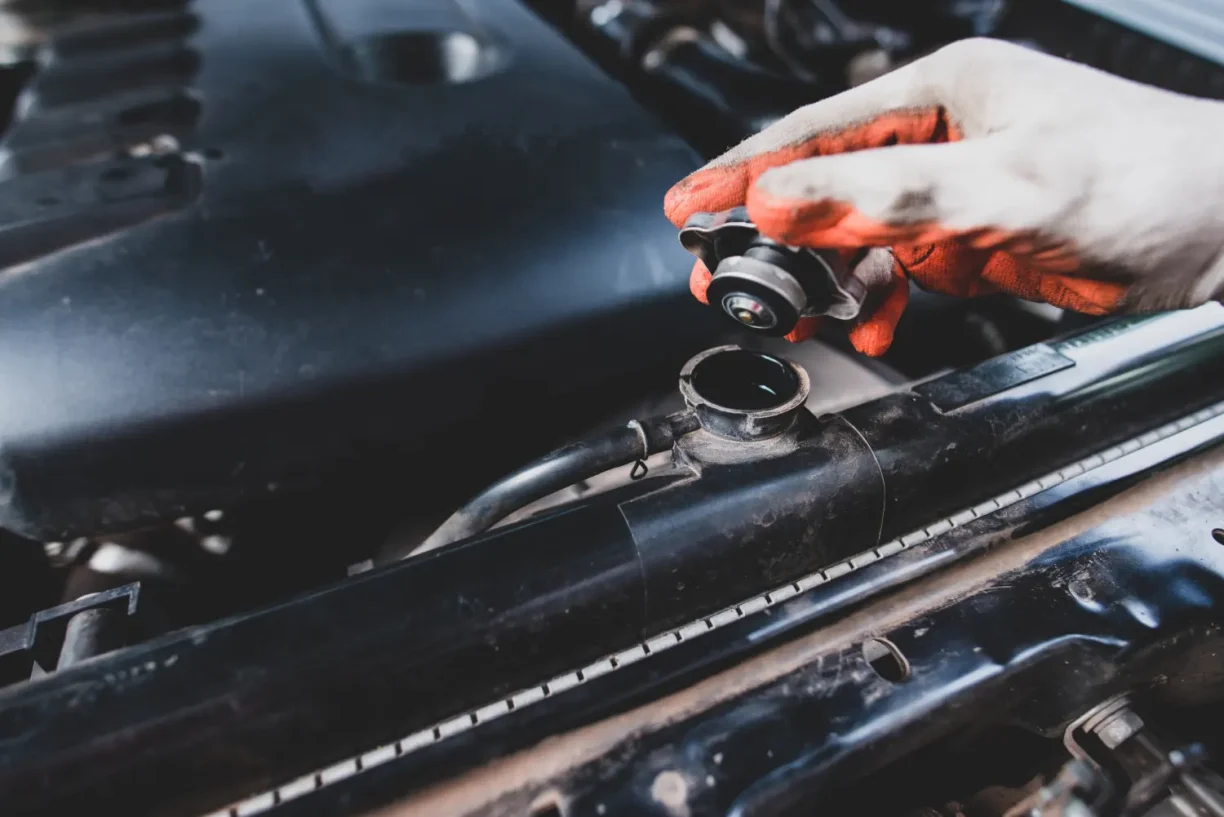 Mechanic inspecting 2023 Nissan Pathfinder SL engine defects for lemon law claim in California