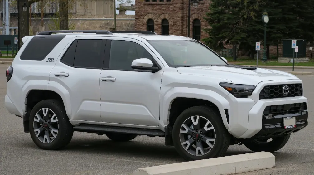White Toyota SUV showcasing exterior design and 2024 Toyota 4Runner specs in an urban setting